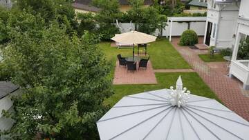 Фото номера Трехместный номер с балконом и общей кухней Гостевой дом Naiza Guesthouse and Apartments г. Юрмала 2